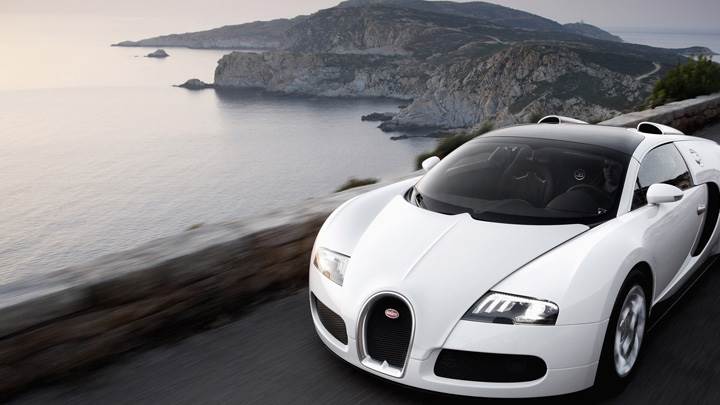 Running Fast Bugatti Veyron 16.4 Grand Sport Near Sea Side In White